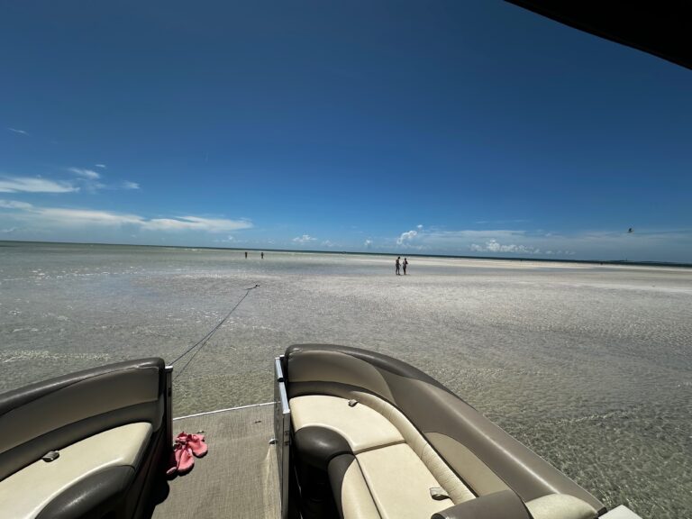 VIew of sandbar, looking out to the Gulf of Mexico from the front of a pontoon boat.