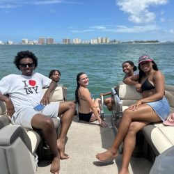 Group of 5 on Pontoon in front of Clearwater Beach